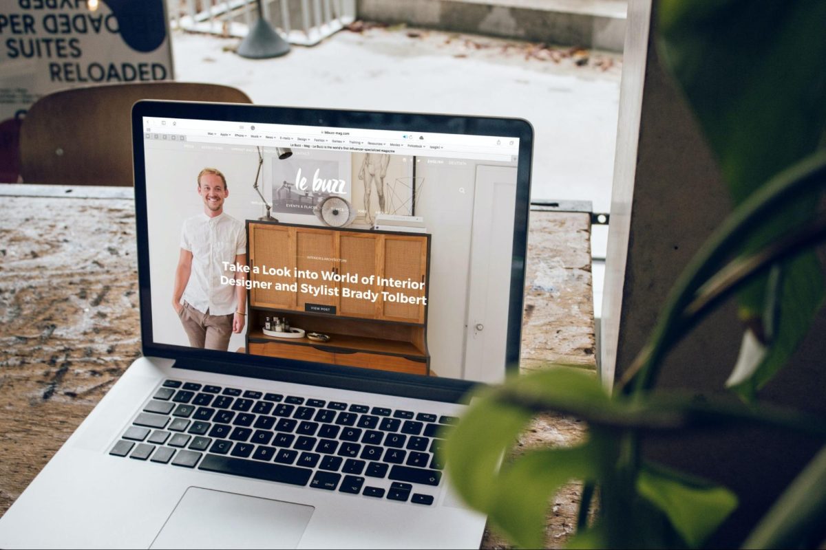 MacBook pro on wooden table displaying customer-driven local business websites